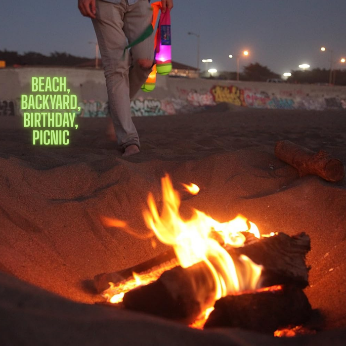 A person holds colorful water guns and a Foxtail LED by a campfire on a sandy beach at dusk. Graffiti, city lights, and the words “BEACH, BACKYARD, BIRTHDAY, PICNIC” highlight how perfect Foxtail LED is for fun outdoor games.